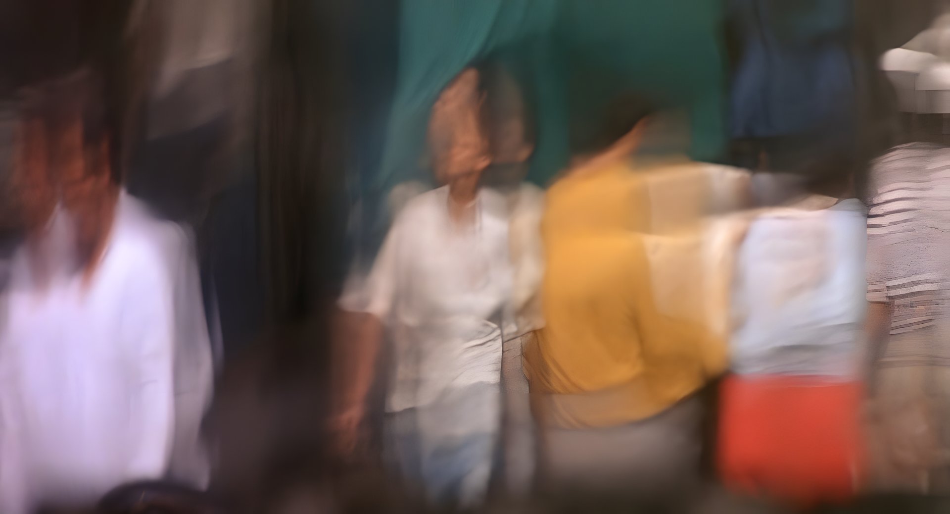 Blurred figures swimming past