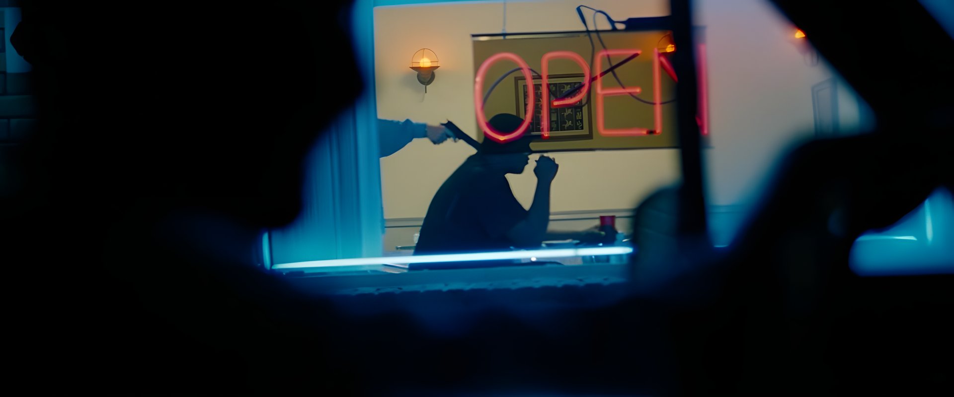 A diner's OPEN neon sign at night