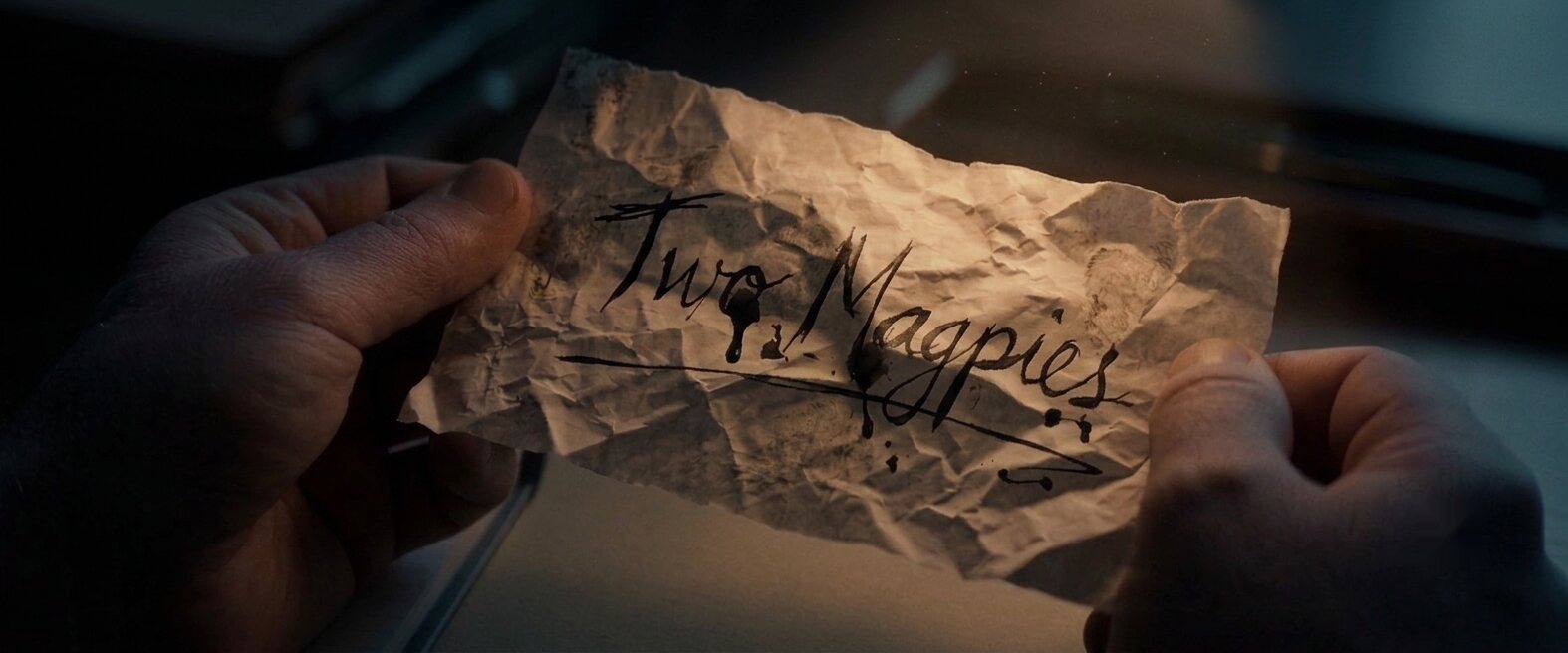 A crumpled note reading Two Magpies