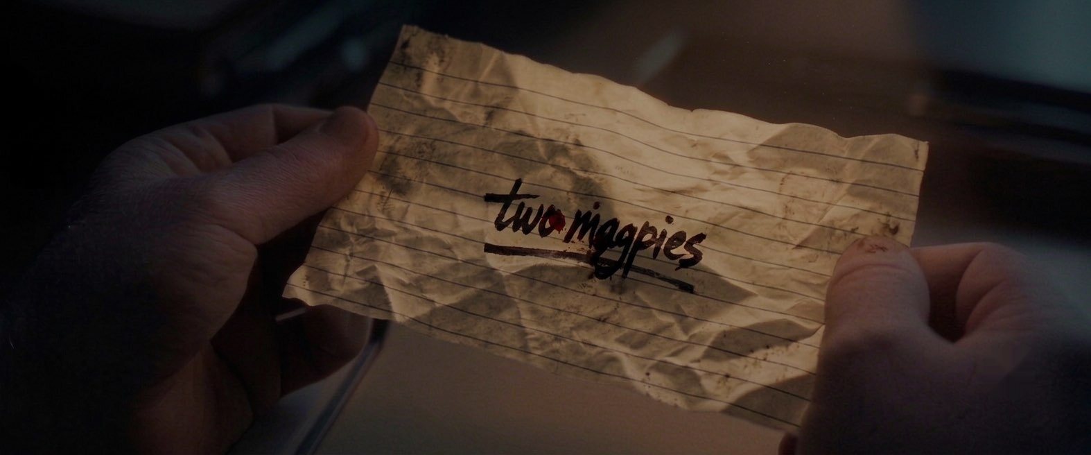 A crumpled note reading Two Magpies